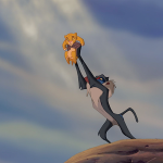 Rafiki, voiced by Robert Guillaume, holds baby cub Simba (Jonathan Taylor Thomas) to the animals gathered around Pride Rock.