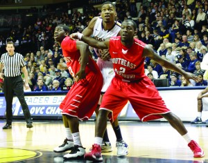 Senior Brandon Garrett struggles to break through Southeast Missouri’s strong defense during the final home game of the season Saturday night.  The Racers need to win two games and to make it to the NCAA Tournament. Lori Allen/The News