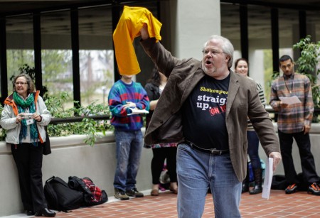  William Jones, assistant professor of English, brandishes a T-shirt Tuesday afternoon  as part of the Shakespeare Festival activities. || Lori Allen/The News