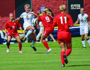 Torrey Perkins/The News Sophomore Alexa Hosey fights for possession in last weeks game against Southern Indiana. 