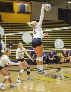 Lori Allen // The News / Sophomore Taylor Olden reaches for a spike against Morehead State last Saturday.
