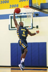 Jenny Rohl/Contributing photographer Junior forward Jarvis Williams dunks the ball in a practice in the Racers’ new practice gym.
