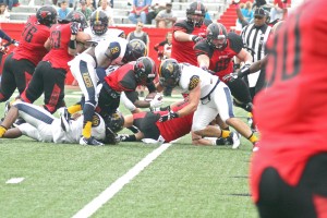Ryan?Richardson/The News Several Racers attempt to stop the Redhawks from scoring one of their five touchdowns Saturday in the loss to SEMO.