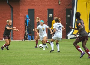 File photo Junior midfielder (3) Julie Mooney carries the ball upfield as junior defender Bronagh Kerens (10) stands open for a pass during a game against University of Arkansas at Little Rock this season.