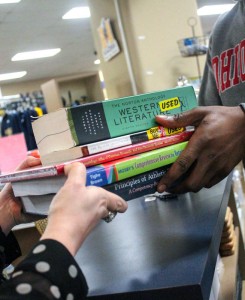 Jenny Rohl/The News A student purchases both new and used books from the University Store.
