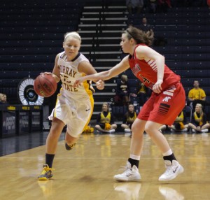Lori Allen/The News Freshman guard Janssen Starks looks to drive past an Austin Peay defender in the Racers’ win. (Photo from Page 1 is junior guard Keiona Kirby.)