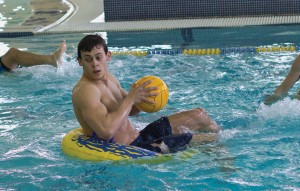 Fumi Nakamura/The News Alpha Sigma Phi’s Nicholas Pray brings the ball up with junior teammate James Nance, during an intramural water polo match against Lambda Chi Alpha Sunday.