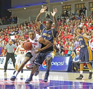 Kate Russell/The News Junior forward Jarvis Williams attempts to keep the Belmont player from scoring.