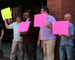 Faculty members joined students in a protest Sept. 9 aimed at continuing a campus-wide discussion about racism. Dozens of faculty and staff took turns holding signs calling for ending racism in the wake of comments posted Aug. 28 from people in Murray on the site Yik Yak. 