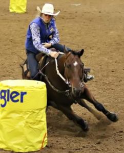 Taylor Smith, freshman from Benton, Ky., runs the barrels in the William ”Bill” Cherry Agricultural Expo Center at the Murray State Rodeo on Oct. 4-6. || Photo courtesy of Taylor Smith