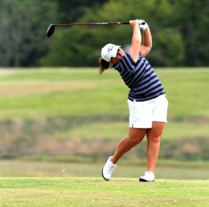Junior Delaney Howson follows through with her swing during a competition in the fall. She medaled in the Racer Classic on Monday and Tuesday. || Photo courtesy of Sports Information