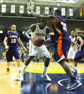 Senior Ed Daniel works his way around UT Martin defender Myles Taylor during Thursday’s home game. Daniel scored 19 points and had one assist for the evening, but, despite a strong off­ensive second half, the Racers lost to the Skyhawks by a single point. || Taylor McStoots/The News