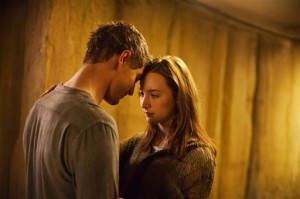 Melanie Stryder, played by Saoirse Ronan, and Jake Abel, played by Max Irons, share a rare romantic moment in director Andrew Niccol’s “The Host.” || AP photo