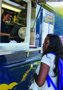 A Murray State student waits outside the mobile food truck, The Pony Express, for her lunch to be prepared.   Photo by Kate Russell / The News