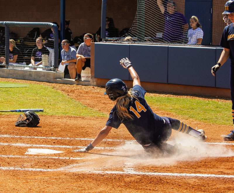 #14 Mo Ramsey, junior outfielder from Pinckneyville, Illinois, scores the very first run ever during the inaugural game at the new softball field. Murray State won both games of the double header on Sunday against St. Catharine 2-0 and 7-4. Taylor McStoots / The News