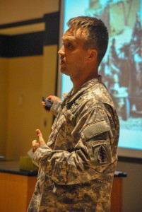 Torrey Perkins /The News  Arnett lectures to students in Jones Hall’s large auditorium about combat medicine and his career.