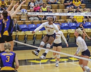Lori Allen // The News / Freshman Kamille Jones (No. 5), from Fort Worth, Texas, successfully spikes for the Racers.