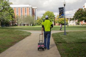 Lori Allen // The News Ray strolling through the quad with his speaker in tow.