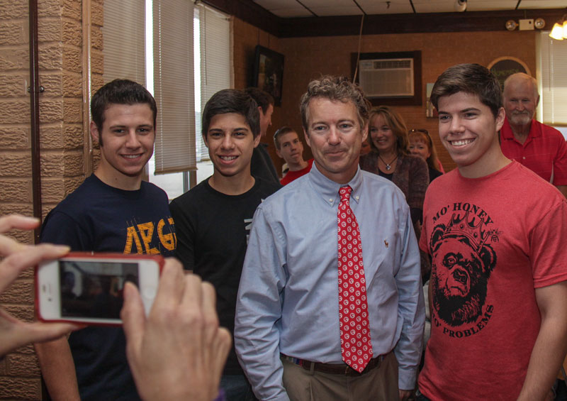 Lori Allen // The News / Sen. Paul poses for a photo with (L-R) Leeman, Seth and Lowell Stevens. Leeman(freshman) and Lowell(senior) are Murray State students and Seth is a high school junior.