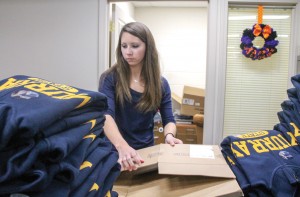 Jenny Rohl/The News Tori Gray, freshman from Harrisburg, Ky., folds sweatshirts in the University Bookstore.