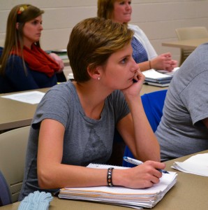 Megan Godby/The News Olivia Reed, graduate student from Bowling Green, Ky., takes notes during class.