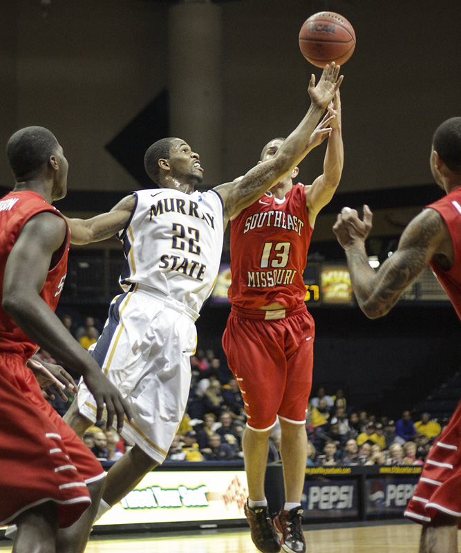 Lori Allen // The News ///  Guard T.J. Sapp (22), junior from Ft. Lauderdale, Fla., goes for the rebound against SEMO. 