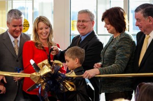 Lexy Gross/The News Henry Crisp II stands by his family as they cut the ribbon on the new Crisp Center in Paducah.
