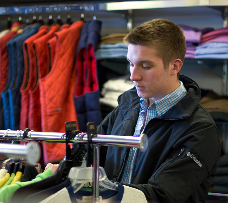 Fumi Nakamura/The News Dylan Baker, sophomore from Madisonville, Ky., shops for a new long-sleeve shirt at Dan’s.