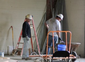 Lori Allen/The News Two workers examine their work while renovating the first floor of Business Building South.