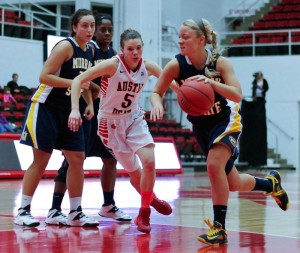Kate RussellThe News Freshman point guard Janssen Starks (right) drives to the lane against Austin Peay earlier this season.