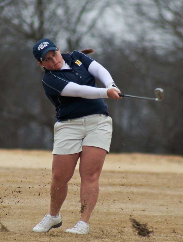 Jenny Rohl/The News Senior Delaney Howson watches her shot in the Racers’ win at the Time Warner Racer Classic. Howson tied for first place in the tournament.