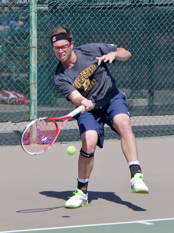 Lori Allen/The News Senior Adam Taylor returns the ball in a match against the University of Tennessee.