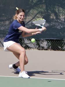 Lori Allen/The News Senior Carla Suga prepares to hit a backhand in her match Sunday.