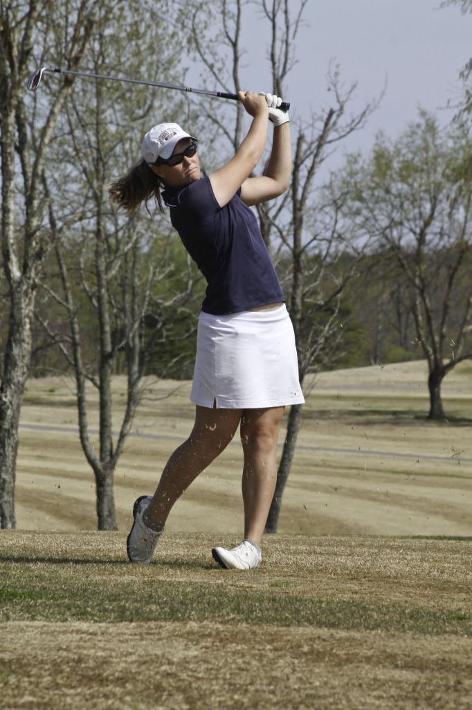 Jenny Rohl/The News Sophomore Abbi Stamper follows through a swing during practice.