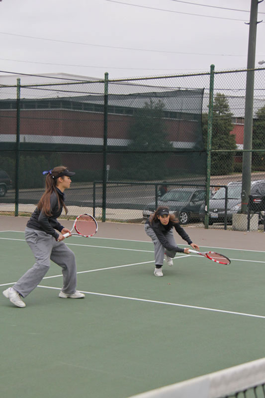 Lori Allen/The News Freshmen twins Eleonore and Virginie Tchakarova play together in a March 30 doubles match against Southern Illinois University Edwardsville.