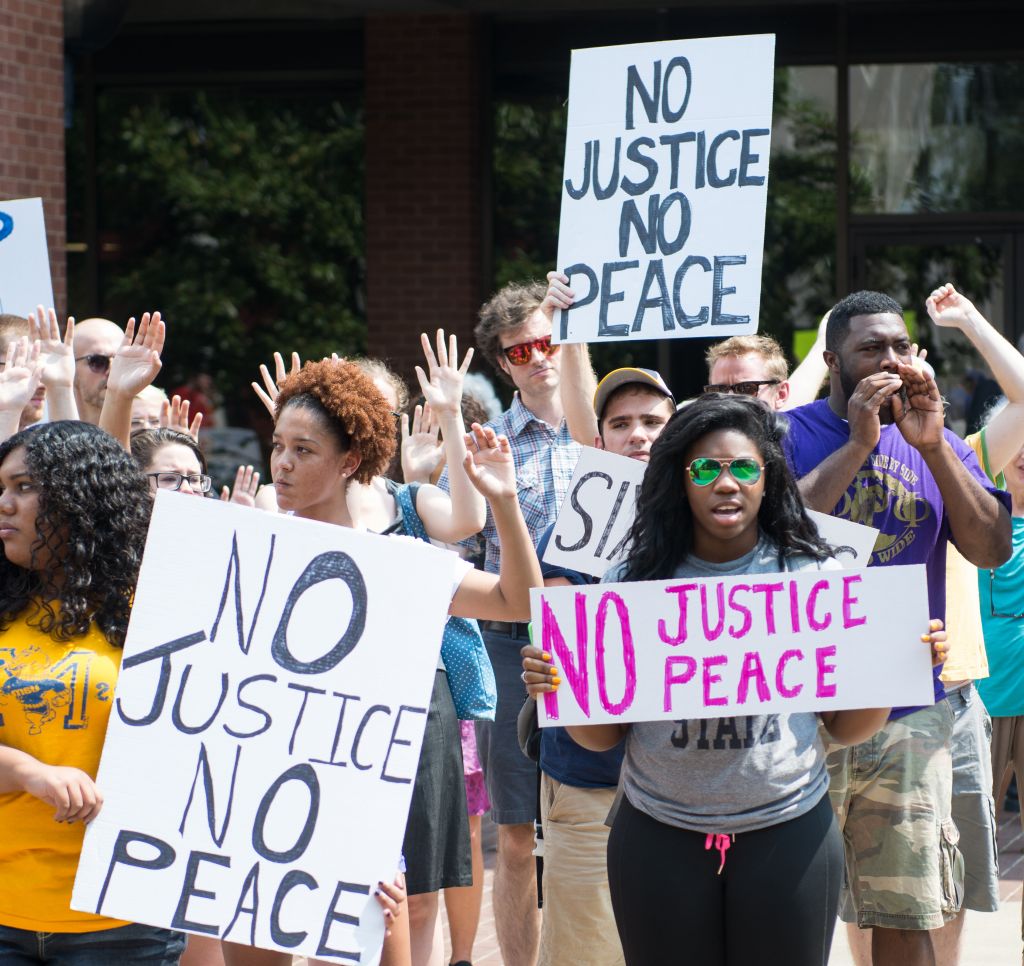 Photos by Kory Savage/The News Students joined outside of Waterfield Library Thursday to protest the shooting of Michael Brown in Ferguson, Mo.