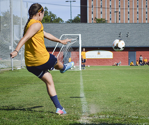 Hannah Fowl/The News GOAL ORIENTED: Junior forward Julie Mooney practices corner kicks at Cutchin Field. Mooney scored four goals in two games against Indiana University-Purdue University Indianapolis and Northern Kentucky and was voted OVC Player of the week by the league’s sports information directors.