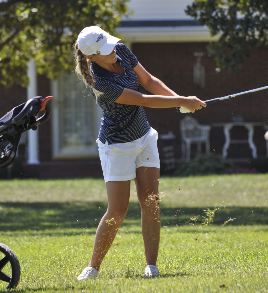 Kylie Townsend/The News Sophomore Sydney Trimble finishes a swing Monday at Drake Creek Golf Course in Ledbetter, Ky.