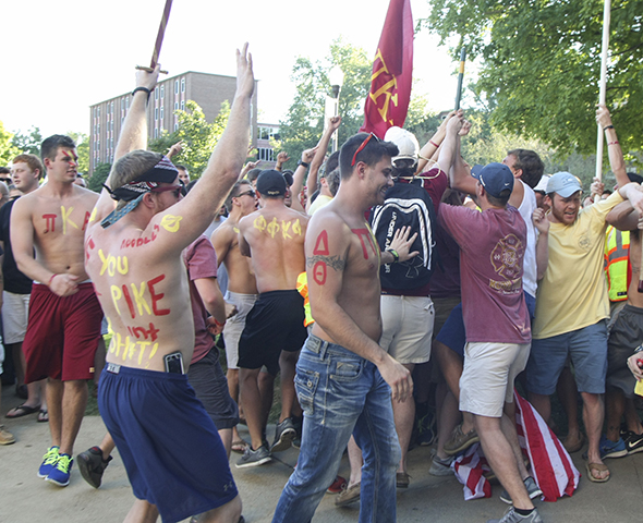 Haley Hays/The News Members of Pi Kappa Alpha welcome the men who accepted their bids Monday at Lovett Auditorium.