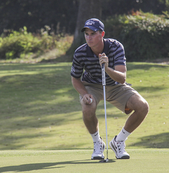 Lori Allen/The News Junior Brock Simmons lines up a putt at Miller Memorial Golf Course last season.
