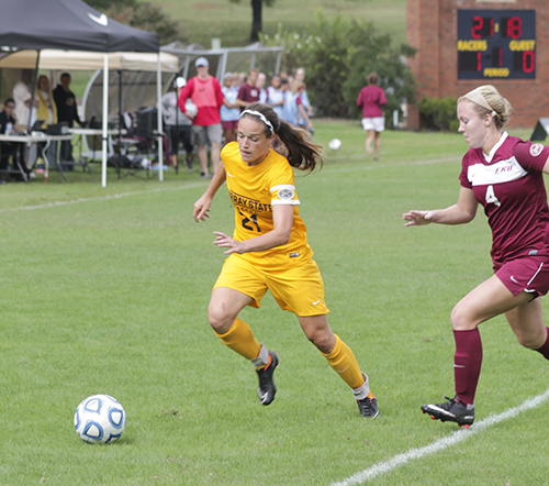 Jenny Rohl/The News Junior defender Taylor Stevens dribbles past an Eastern Kentucky player Sunday at Cutchin Field.