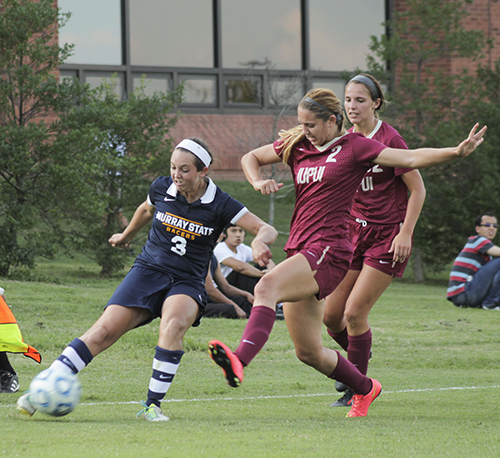 Jenny Rohl/The News Senior forward Julie Mooney keeps the ball away from two IUPUI players Sept. 19 at Cutchin Field.