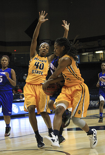 Kalli Bubb/The News Above: Freshman guard Olivia Cunningham and senior forward Chanyere Hosey defend against Tennessee State players. 