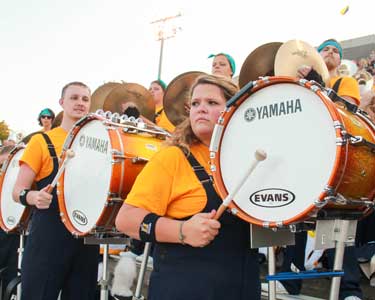 Jenny Rohl/The News Drum line members look at racer band director, John Fannin, for its cue during Thursday night’s game against Kentucky Wesleyan.