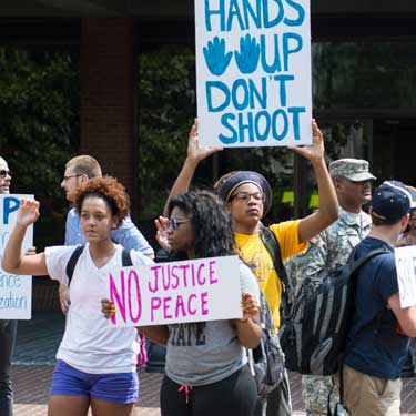 File Photo Students protest outside of Waterfield Library last fall because of the shooting of Mike Brown in Ferguson, Missouri.