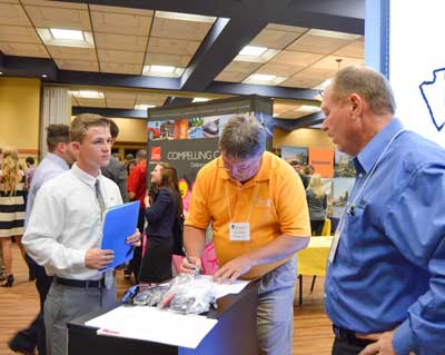 Emily Harris/The News An Occupational Safety and Health major, Mathew Cardani, sophomore from New Philadelphia, Ohio, met with Flint Howard and Tim Wallin, representatives from Flintco, during the STEM Career Fair Wednesday.  