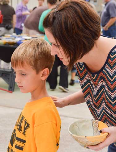 Emily Harris/The News Amanda Vancura, senior from Samsonia, was one of the workers helping out with the event.