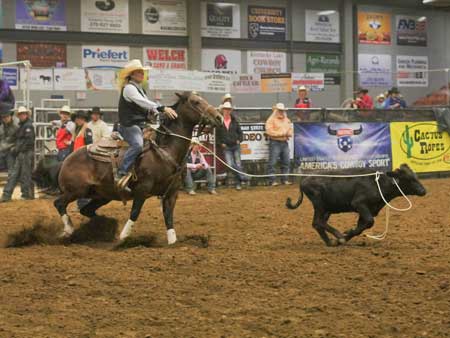 Jenny Rohl and Chalice Keith/The News Competitor competes in calf roping.