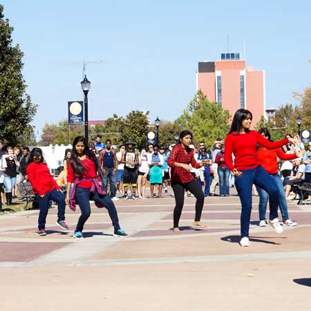 Zachary Maley/The News FLASH MOB: When dozens of students occupy one of the most popular walkways on campus in synchronized dance moves, it makes people pause, take many photos and enjoy the surprise show from the Indian Student Association.