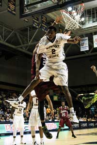 Kalli Bubb/The News Senior forward Jeffrey Moss comes down from a dunk during their game against the Saluki’s.